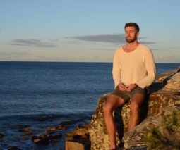Luke McLeod from Soul Alive meditating by the ocean