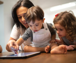 Mother with disabled son using tablet - feature