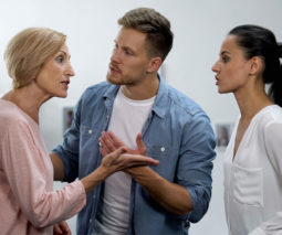 A younger couple fighting with an older woman