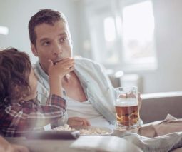 Father drinking beer with child