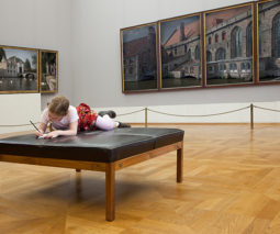 Girl drawing in an art gallery