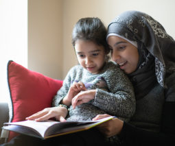 Mother reading with daughter
