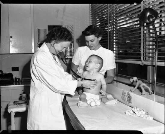 Nurse with mother and baby