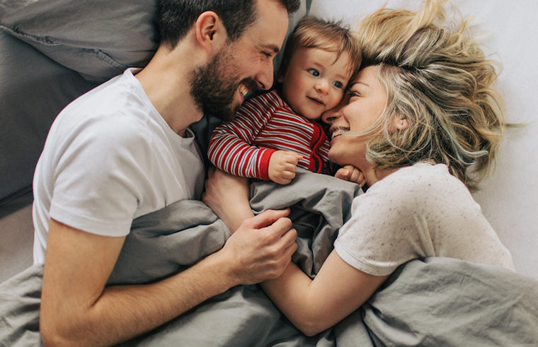 Baby in bed with parents