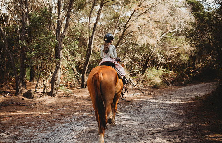 girl horseriding in bush